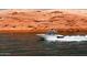 White powerboat speeding across the lake near red rocks at 16172 W Alameda Rd, Surprise, AZ 85387