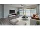 Living room with sliding doors leading to backyard at 16172 W Alameda Rd, Surprise, AZ 85387