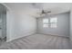 Empty bedroom with plush carpeting and ceiling fan at 16172 W Alameda Rd, Surprise, AZ 85387
