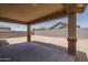 Covered patio overlooking a large backyard at 16172 W Alameda Rd, Surprise, AZ 85387