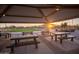 Scenic community picnic area with tables and benches at sunset at 16172 W Alameda Rd, Surprise, AZ 85387