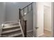 Modern staircase with wood railing leading to upper level at 16172 W Alameda Rd, Surprise, AZ 85387