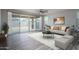 Bright living room with sliding glass doors leading to backyard at 16172 W Alameda Rd, Surprise, AZ 85387