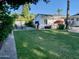 Spacious backyard with grass, patio, and detached studio at 895 W Tyson St, Chandler, AZ 85225