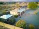 Aerial view showing home, gazebo, and mercantile building at 19950 W Cambridge Ave, Buckeye, AZ 85396