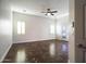 Bright bedroom with tile floors and a door to outside at 19950 W Cambridge Ave, Buckeye, AZ 85396