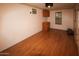 Simple spare room with wood flooring and built-in cabinets at 19950 W Cambridge Ave, Buckeye, AZ 85396