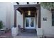 Inviting front entrance with double doors and a charming sitting area at 19950 W Cambridge Ave, Buckeye, AZ 85396