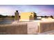 Large rooftop deck with stucco walls and city views at 19950 W Cambridge Ave, Buckeye, AZ 85396