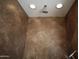Shower with tiled walls and recessed lighting at 19950 W Cambridge Ave, Buckeye, AZ 85396