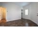 Spacious bedroom with tile floors and access to hallway at 19950 W Cambridge Ave, Buckeye, AZ 85396
