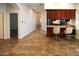 Small kitchen with granite counters and breakfast bar at 19950 W Cambridge Ave, Buckeye, AZ 85396
