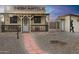 Rustic-style Western-themed building with a walkway leading to the entrance at 19950 W Cambridge Ave, Buckeye, AZ 85396