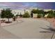 Long curved driveway leading to a three-car garage at 19950 W Cambridge Ave, Buckeye, AZ 85396