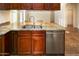 Double stainless steel sink with granite countertop at 19950 W Cambridge Ave, Buckeye, AZ 85396