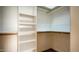 Bright walk-in closet with ample shelving and hanging space at 19950 W Cambridge Ave, Buckeye, AZ 85396