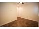 Large bedroom with tile floors and access to hallway and bathroom at 19950 W Cambridge Ave, Buckeye, AZ 85396