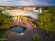 Aerial view of property showcasing a pond and large home at 19950 W Cambridge Ave, Buckeye, AZ 85396