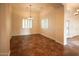 Formal dining room with tile floors and plantation shutters at 19950 W Cambridge Ave, Buckeye, AZ 85396