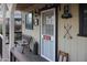 Quaint front porch with a vintage bench and Coca-Cola signage at 19950 W Cambridge Ave, Buckeye, AZ 85396