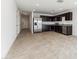 Modern kitchen with dark cabinets and stainless steel appliances at 12313 E Aster Ln, Florence, AZ 85132