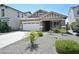 Single story home with a two-car garage and desert landscaping at 35528 N Zachary Rd, San Tan Valley, AZ 85144