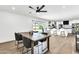 Kitchen dining area with wooden table, gray chairs and ceiling fan at 2030 E Duke Dr, Tempe, AZ 85283