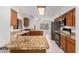 Kitchen boasts granite countertops, wood cabinets, and stainless steel appliances at 2605 N 89Th Dr, Phoenix, AZ 85037