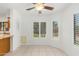 Charming breakfast nook with tiled floors and window bench at 2605 N 89Th Dr, Phoenix, AZ 85037
