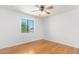 Bedroom with hardwood floors and ceiling fan at 2605 N 89Th Dr, Phoenix, AZ 85037