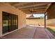 Covered patio with sliding glass doors and brick flooring at 2605 N 89Th Dr, Phoenix, AZ 85037
