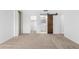 Spacious bedroom with carpeted floor and mirrored closet doors at 2605 N 89Th Dr, Phoenix, AZ 85037