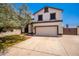 Two-story house with a two-car garage and landscaped yard at 2605 N 89Th Dr, Phoenix, AZ 85037