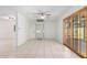 Bright dining room with tile floors, sliding glass door, and home elevator at 2605 N 89Th Dr, Phoenix, AZ 85037