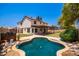 Two-story house with a large backyard, covered patio, and pool at 2605 N 89Th Dr, Phoenix, AZ 85037
