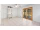 Bright dining room with tile floors, sliding glass door, and home elevator at 2605 N 89Th Dr, Phoenix, AZ 85037