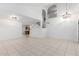 Spacious living room with high ceilings and tile flooring at 2605 N 89Th Dr, Phoenix, AZ 85037