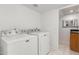 Laundry room with Maytag washer and dryer at 2605 N 89Th Dr, Phoenix, AZ 85037