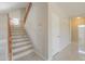 Modern staircase with wood railing and light-colored risers at 1121 E Jahns Dr, Casa Grande, AZ 85122