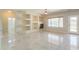 Gathering room with built-in shelving, fireplace, and backyard access at 1121 E Jahns Dr, Casa Grande, AZ 85122