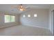 Spacious main bedroom with high ceilings and a ceiling fan at 1121 E Jahns Dr, Casa Grande, AZ 85122
