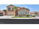 Two-story house with tan exterior and a three-car garage at 1121 E Jahns Dr, Casa Grande, AZ 85122