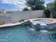 Relax in this bubbling spa with a waterfall feature at 1121 E Jahns Dr, Casa Grande, AZ 85122