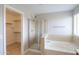 Bathroom with a large shower, bathtub, and walk-in closet at 1121 E Jahns Dr, Casa Grande, AZ 85122