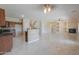 Open floor plan with kitchen, living room, and fireplace at 1121 E Jahns Dr, Casa Grande, AZ 85122