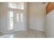 Bright entryway with tile flooring and a white door with glass at 1121 E Jahns Dr, Casa Grande, AZ 85122