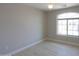 Bright bedroom with wood-look floors and large window at 1121 E Jahns Dr, Casa Grande, AZ 85122