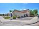 Two-story house with a tan exterior and lush landscaping at 1121 E Jahns Dr, Casa Grande, AZ 85122