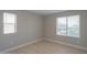 Spacious bedroom with light walls and two large windows at 1121 E Jahns Dr, Casa Grande, AZ 85122