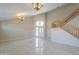 Two-story entryway with tile flooring and an open staircase at 1121 E Jahns Dr, Casa Grande, AZ 85122